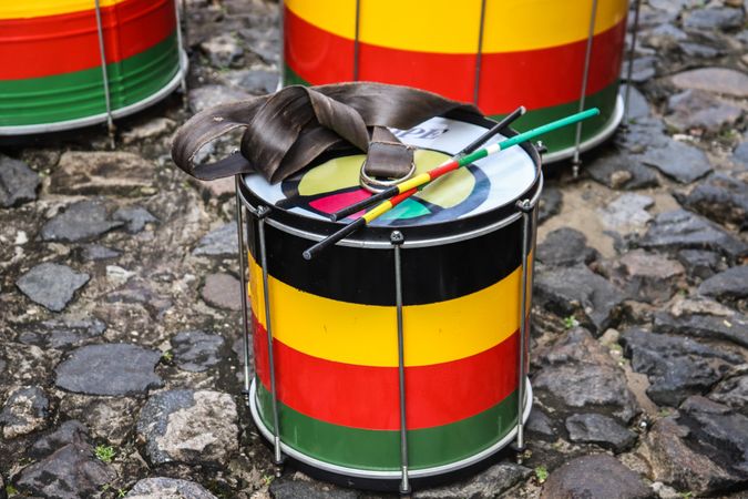 Red yellow and green drums on floor