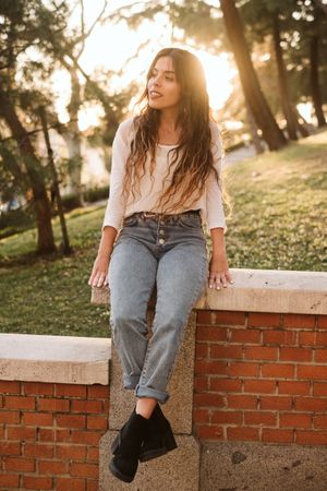 Cheerful young woman in street