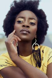 Portrait of young woman in yellow dress