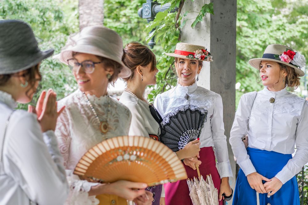 Vintage female friends speaking in garden