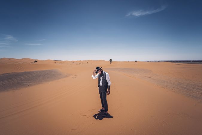 Bearded cowboy in desert