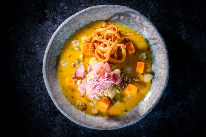 Pumpkin puree soup on table