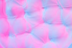 Ripples lit with vibrant bold gradient holographic colors