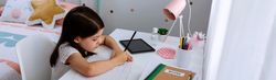 Girl studying at home with mask on table