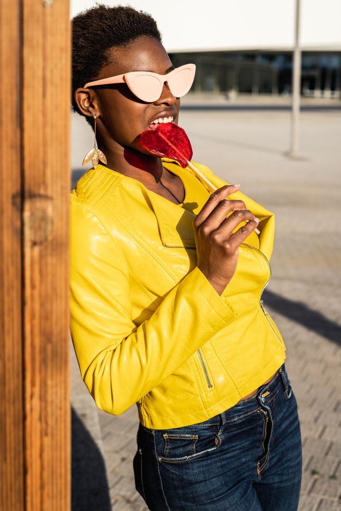 Black woman eating candy