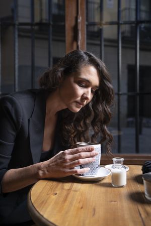 Young female with tea cup in cafe