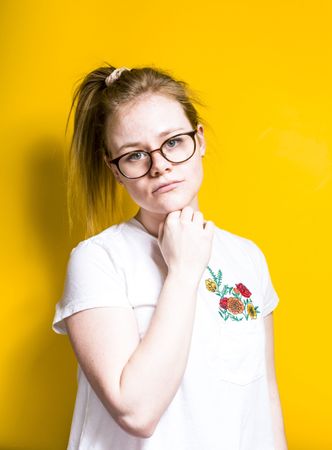 Pensive woman in glasses