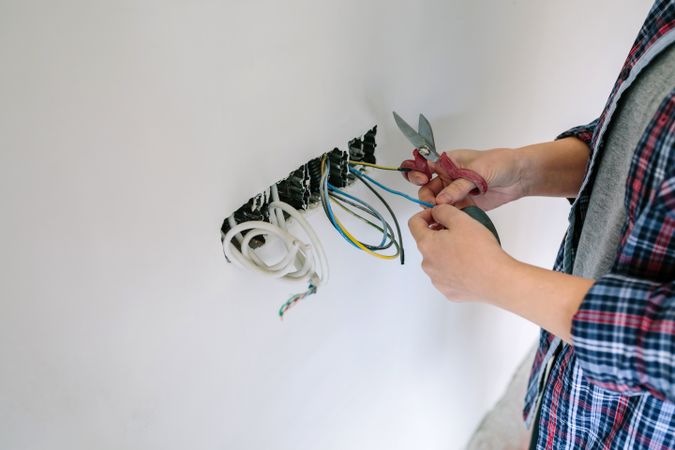Electrician working on the electrical installation of a house