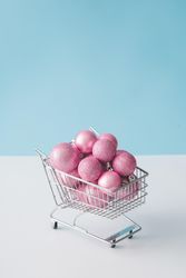 Shopping cart with pink Christmas decorations