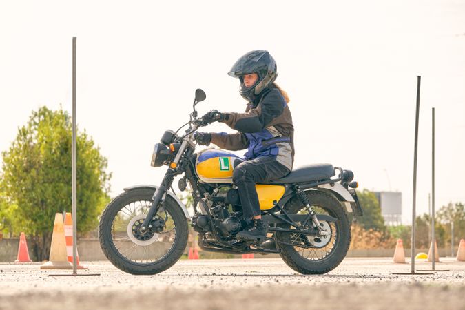 Woman riding motorcycle on motordrome