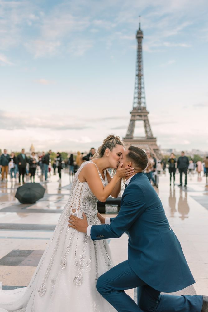 Happy newlyweds in wedding clothing kissing