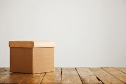 Cardboard box on wooden table