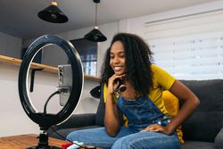 Young woman creates content with phone