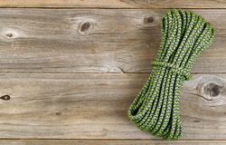 New nylon climbing rope on rustic wood