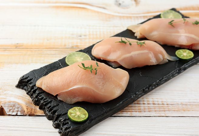 Raw chicken breast with lime ready for cooking