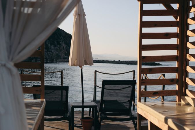 Beach lounger with canopy and morning sea water view