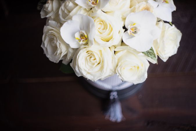 Gift box with roses and orchids
