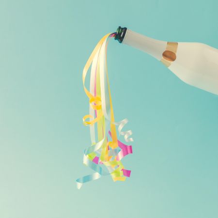 Champagne bottle with party streamers