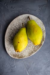 Top view of pears in grey plate