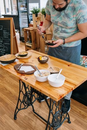 Chef preparing vegan breakfast bowl during cooking master class. Healthy cooking workshop concept.