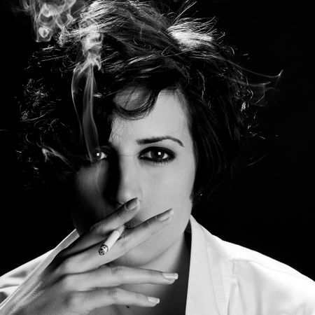 Woman smoking cigarette in monochrome
