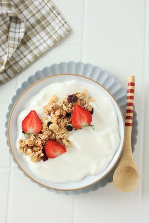 Top View Greek Yoghurt with Granola and Strawberry Topping