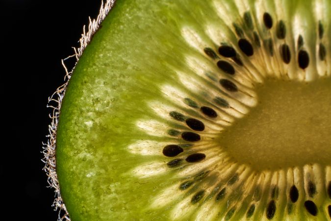 Fresh kiwi fruit texture on dark background