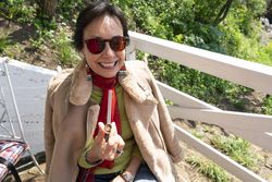 Woman smiling with marijuana pipe