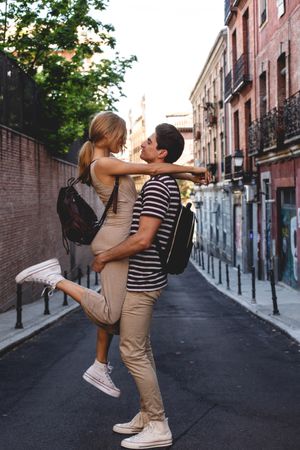 Happy couple having fun while walking in town
