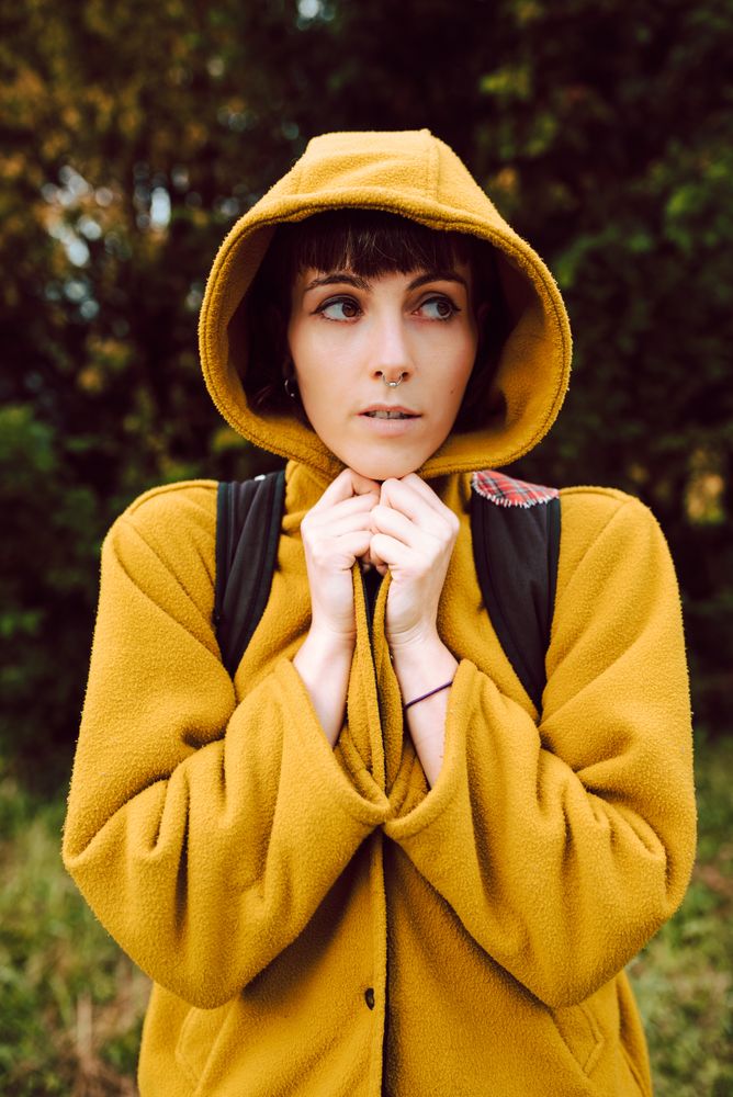 Frozen woman wrapping in coat