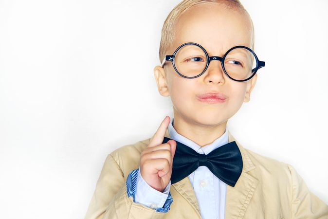Cute blond boy in spectacles