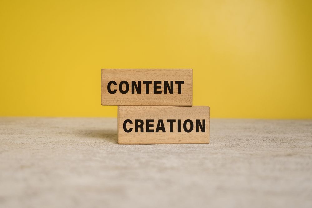 content creation words on wooden blocks on yellow background