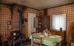Kitchen of the humble cabin where Elvis Presley was born in 1935, Tupelo, Mississippi v4m3v0