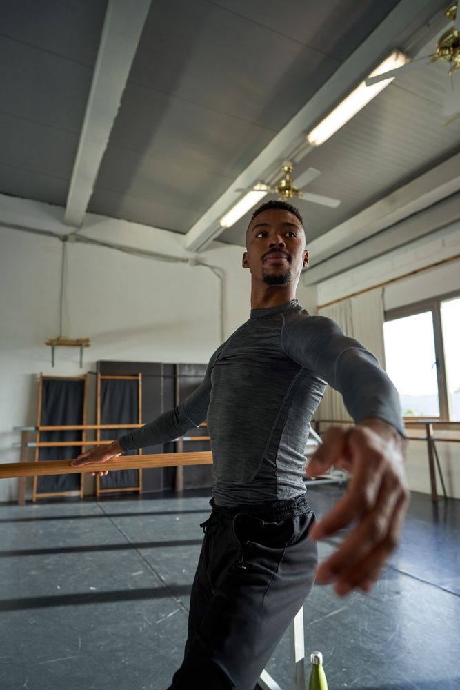 dancer in a warm-up and dancing in a ballet class