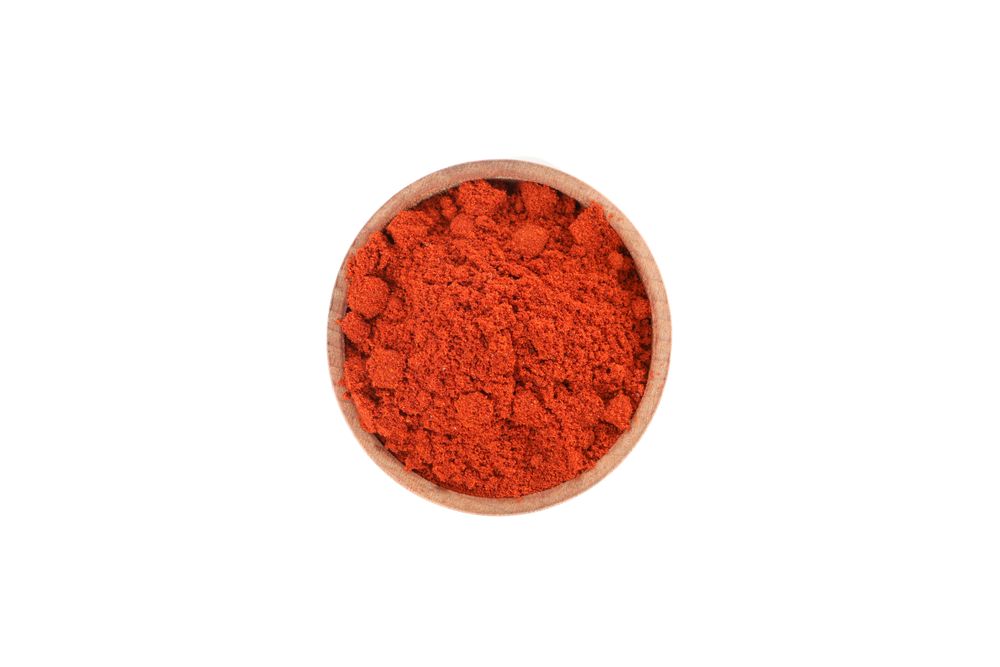 Looking down at bowl of dark red spice