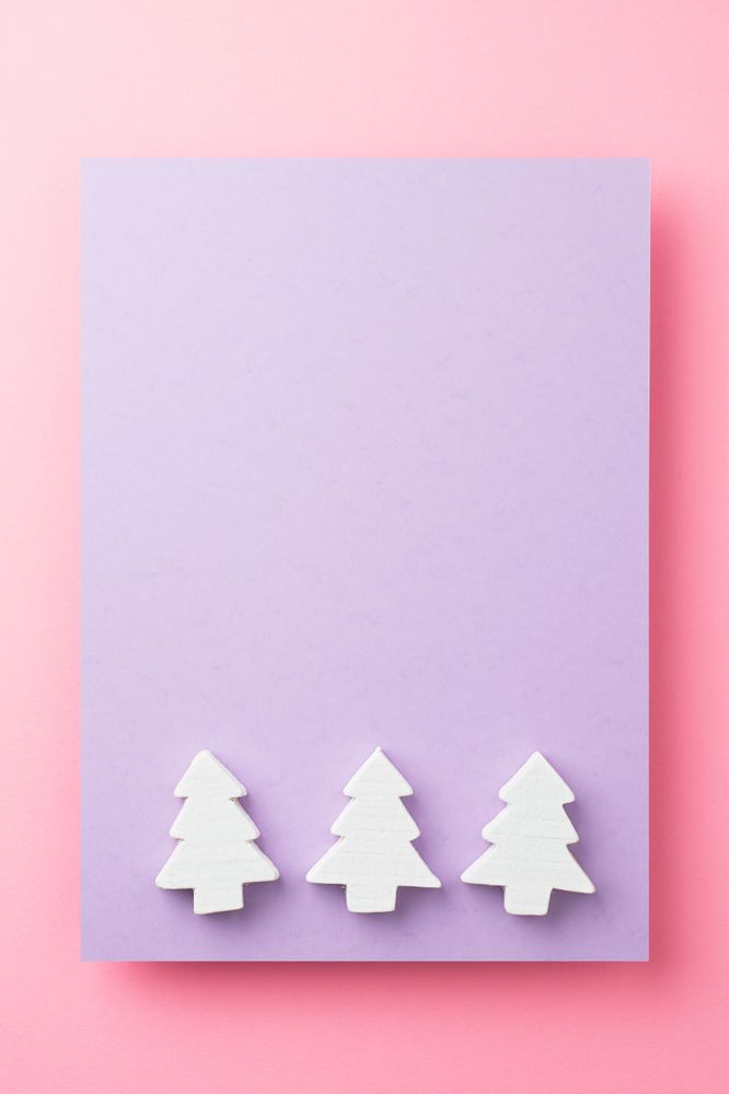 Light pine trees on purple and pink background