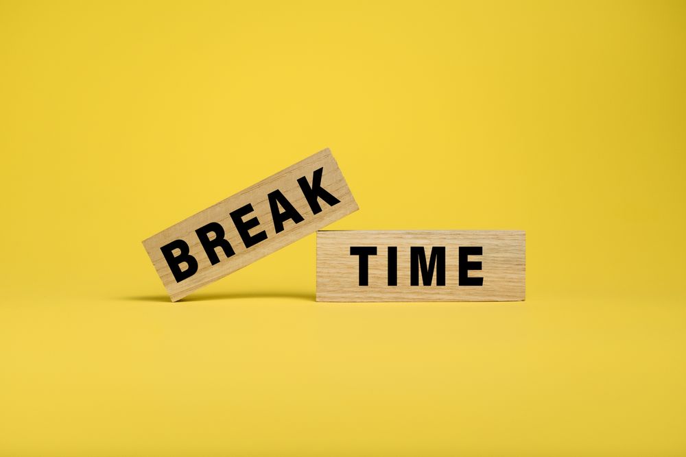 break time words text on wooden blocks isolated on yellow background