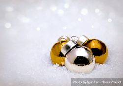 Christmas holiday baubles on snow 4Baakx