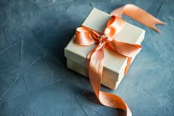 Gift box concept with peace ribbon