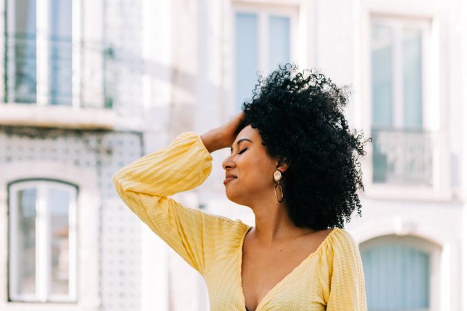 Black female standing on street