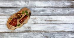 Smoked salmon trout on olive board