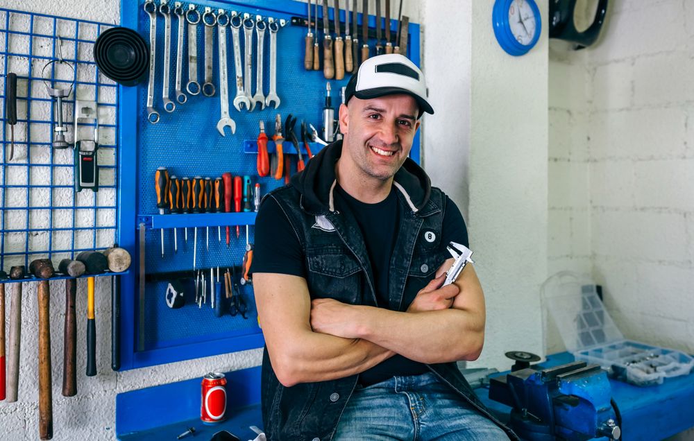 Mechanic posing with a motorcycle