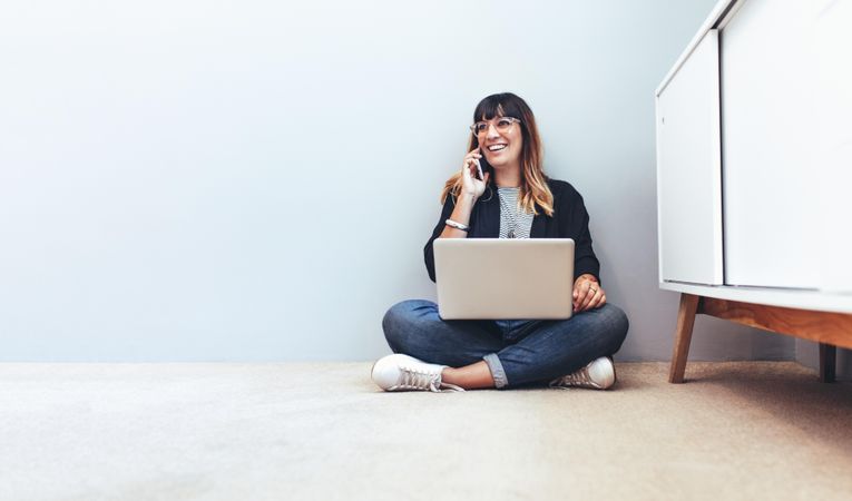 Female entrepreneur managing business sitting at home