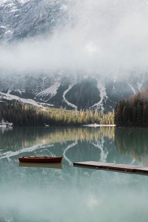 Beautiful lake with boast with mountains behind