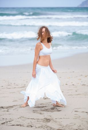woman dancing near sea