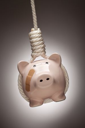 Piggy Bank with Bandage Hanging in Hangman's Noose