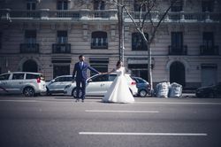 Newlyweds holding hands on road