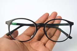 Hand holding spectacles