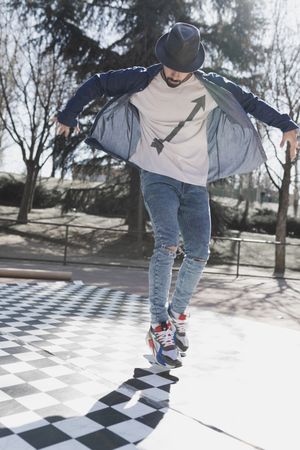 Man dancing break dance in park