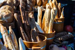 Variation of freshly baked baguettes & breads for sale